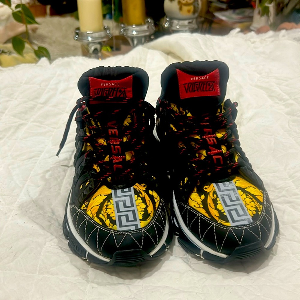 Versace fashion sneakers with yellow details and red laces. Limited edition.